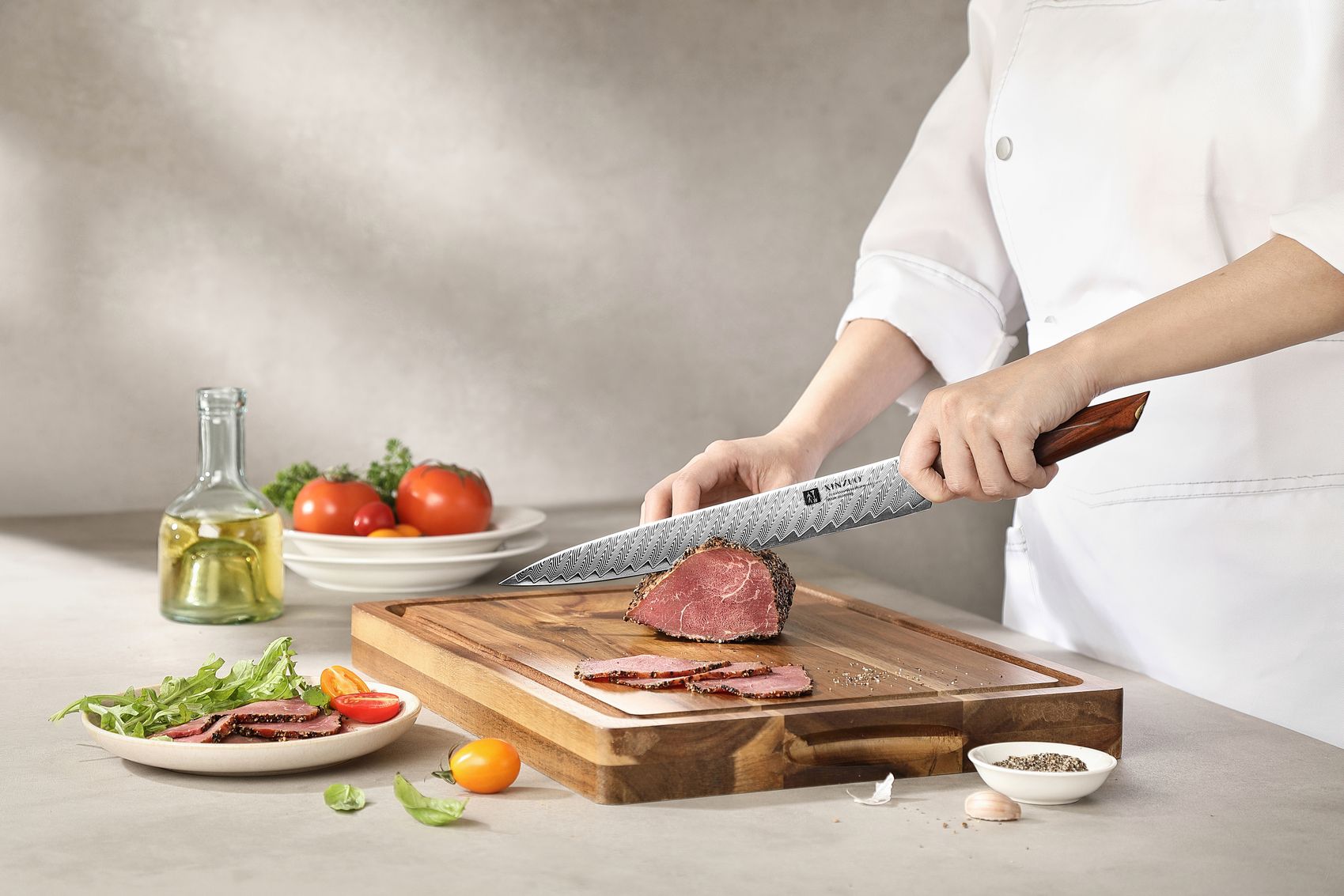 Chef slicing roast beef with the carving knife, hands gripping the rosewood handle