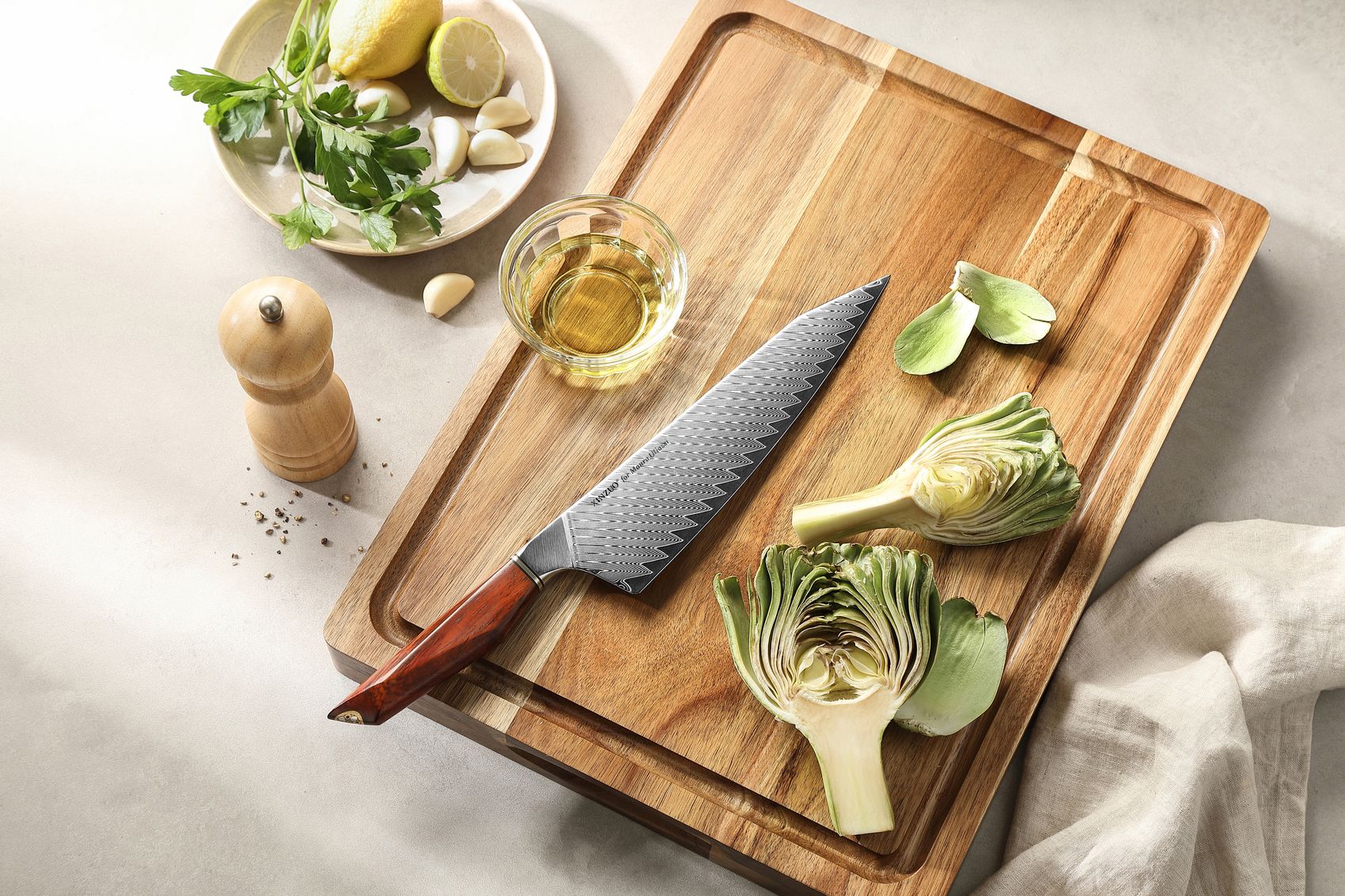 Damascus bunka chef knife beside its wooden saya sheath on a cutting board with fresh produce