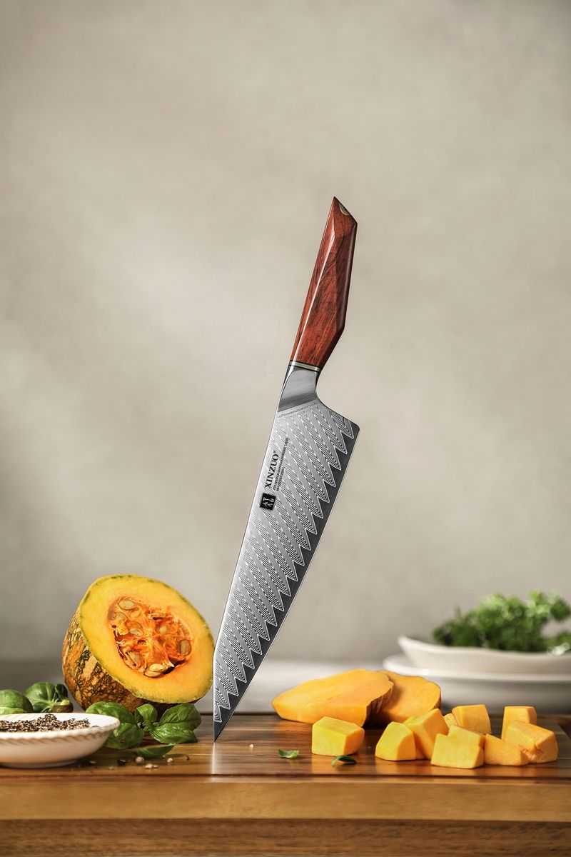 Studio shot of the Damascus-clad blade and rosewood handle of the XINZUO bunka chef knife