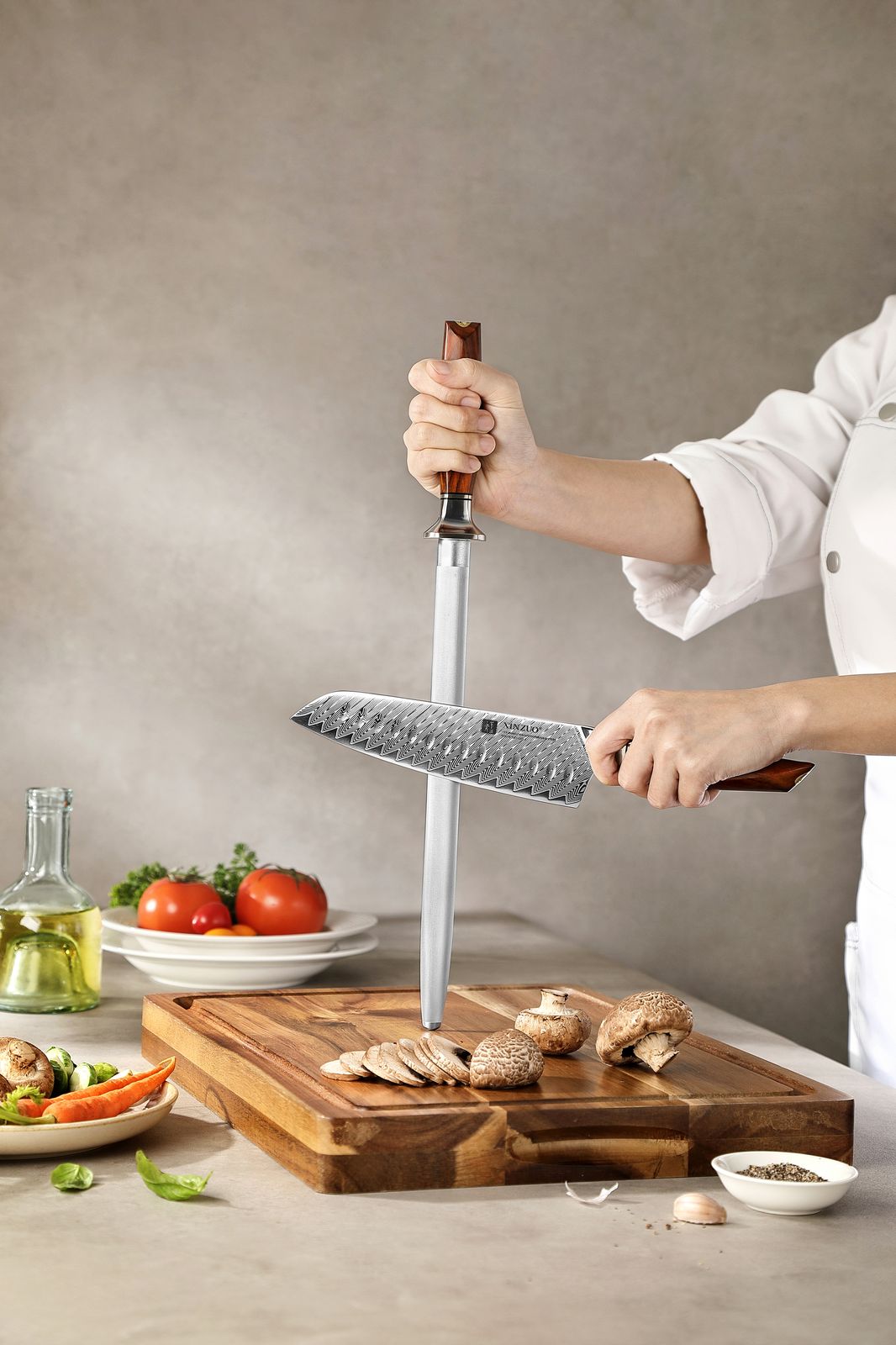 Chef honing a knife with the X03 rod