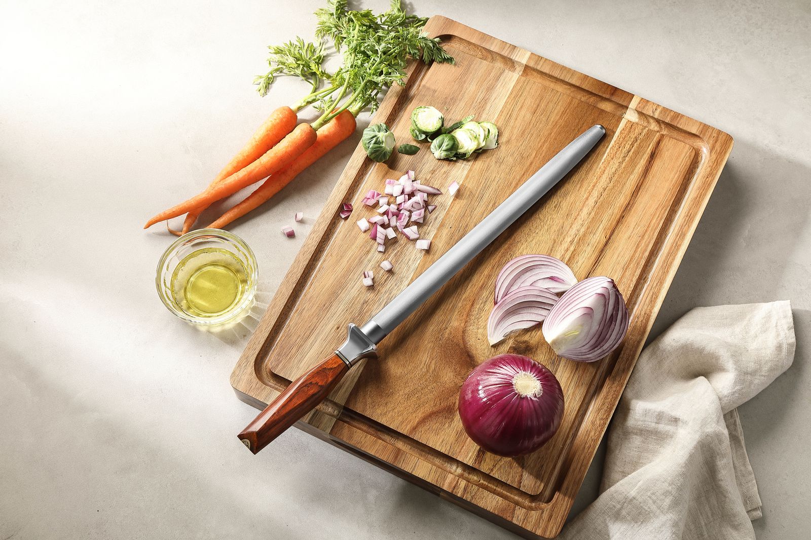 X03 honing rod on a board with fresh produce